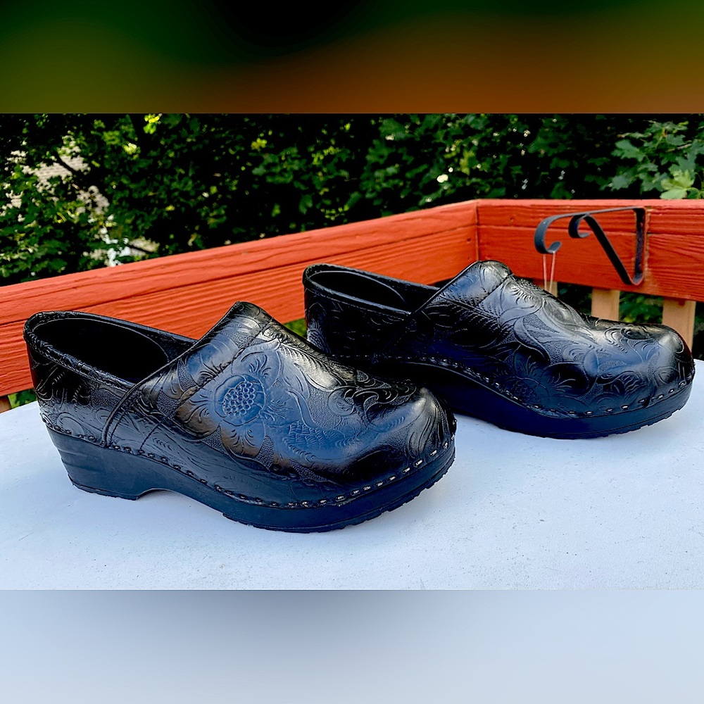 Woman’s black tooled professional clog